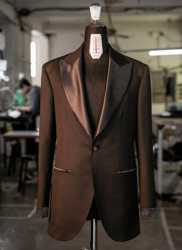 Brown tuxedo jacket on a mannequin in an indoor setting