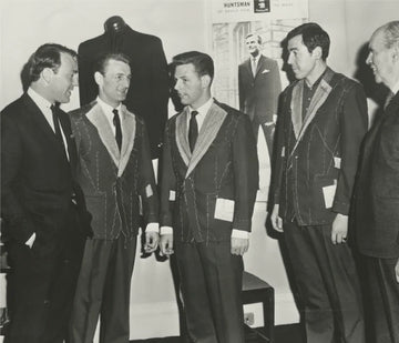 Group of men in suits and ties in a formal setting