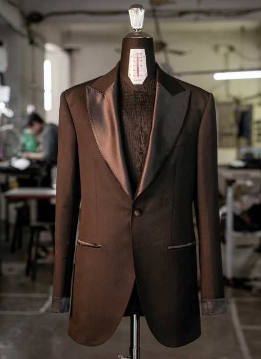 Brown tuxedo jacket on a mannequin in an indoor setting
