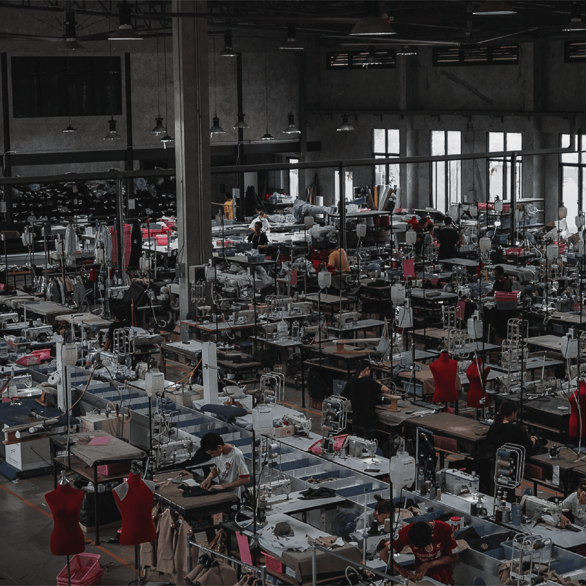 Factory interior with numerous workers and machinery