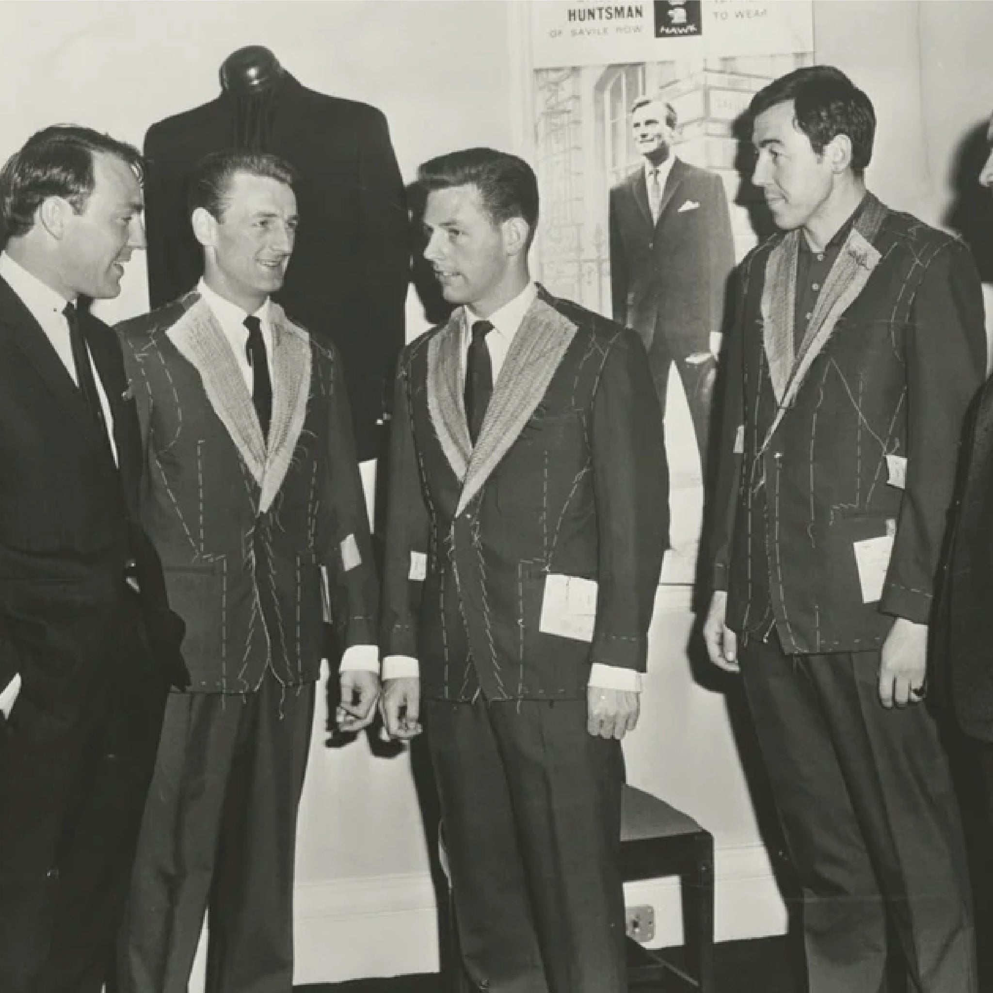Group of men in suits and ties in a formal setting